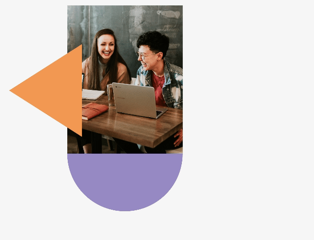 Two people working together with shapes outlining the image.